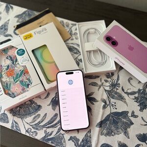 Apple iPhone with Purple Case and Accessories